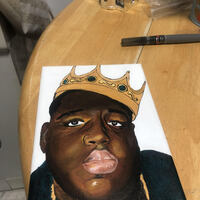 This is a picture of a drawing made of a black man wearing a crown. 