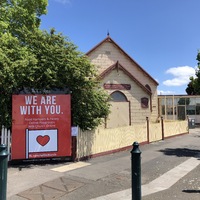 Church in Williamstown, Victoria, Australia that has a sign out front reading "We Are With You". 