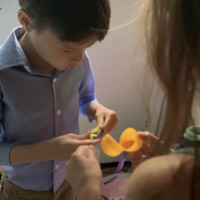 Screenshot of a video of a child opening Easter eggs.
