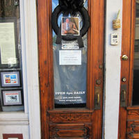 The door of Snug Harbor, a music venue on Frenchmen Street in New Orleans, LA, is hung with a black mourning wreath to mark the death of Ellis Marsalis, beloved pianist and music educator. 