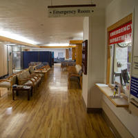 A screenshot of an empty waiting room in the emergency room.
