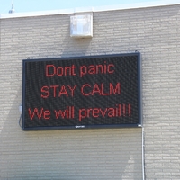 Digital Sign reading "Don't Panic. STAY CALM. We will prevail!!".