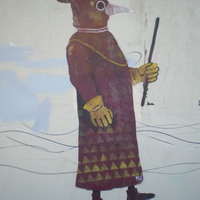 A mural of a plague doctor. 