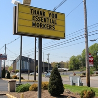 A restaurant sign reading "Thank You Essential Workers".