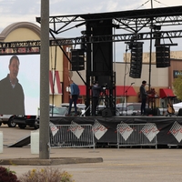 Photo of a stage in a parking lot.
