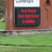 A LED sign outside a church reading No In Person Wed Night Dinner and Activities. 