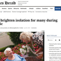 Screenshot of The Times Herald web article.  Image of woman handing flowers to elderly woman.  Headline reads, "Flowers brighten isolation for many during pandemic". 