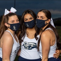 Three masked cheerleaders.