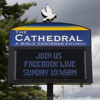 A sign outside The Cathedral: A Bible Centered Church reading "Join us. Facebook Live Sunday 10:45 am".