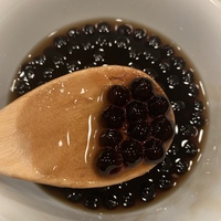 This is a picture of a bowl of Tapioca pearls, which are used as an ingredient in bubble tea. 
