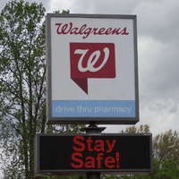 Photo of a sign outside a Walgreens reading "Stay Safe!"