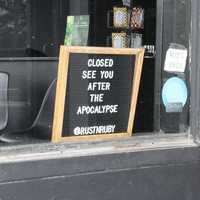 A business sign reading "Closed. See you after the apocalypse". 