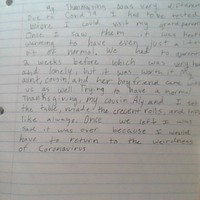 This is a picture taken of a paragraph written on notebook paper about a person's experience celebrating Thanksgiving during the COVID-19 pandemic. 