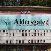 A church sign reading "The Church is Not the Building. Be the Church".