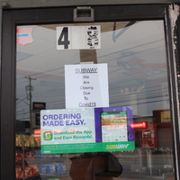 A sign at Subway that says: "We are closed due to Covid-19."